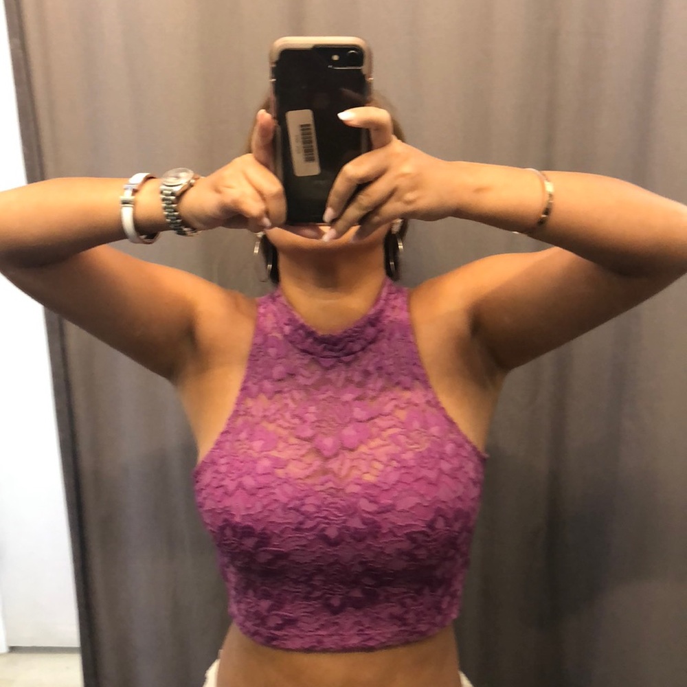 Bebe purple lace crop top, showing belly